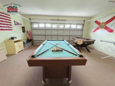 a billiard room with a pool table in it at 35 - Relax & Play 4-Bed Villa with Pool & Game Room Minutes to Disney in Orlando