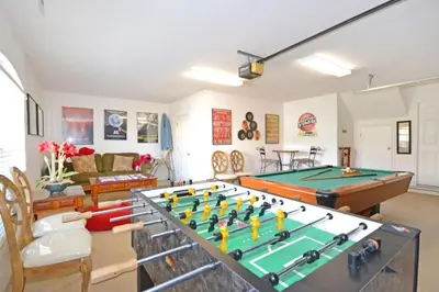 a living room with a ping pong table at Lake House at Formosa home in Orlando