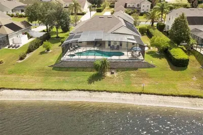 an aerial view of a house with a swimming pool at Lake House at Formosa home in Orlando
