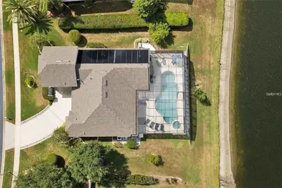an overhead view of a house with a swimming pool at Lake House at Formosa home in Orlando