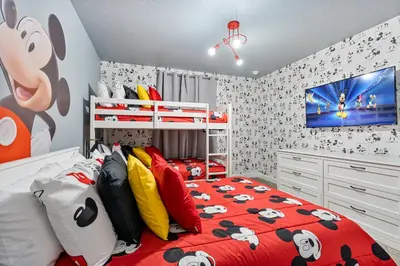 a childs bedroom with a mickey mouse bedroom at New Home 4 Bedrooms 3 Bathrooms At Storey Lake in Kissimmee