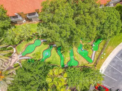 an overhead view of a park with green golf courses at Near Disney + FREE Clubhouse + Pool + GYM + Sauna in Kissimmee