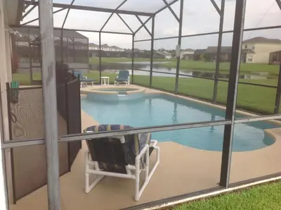 a view of a swimming pool through a window at Sweet Memories in Kissimmee