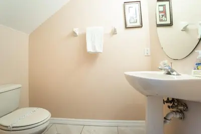 a bathroom with a sink and a toilet and a mirror at Sweet Memories in Kissimmee