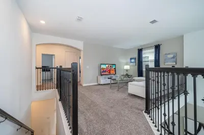 a living room with a couch and a table at 4156DS VILLA 5 BED/5 BA in Kissimmee