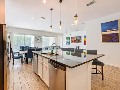 a kitchen with a sink and a counter top at Elegant Villa 12BD-12BA Vacation Haven BV368 in Kissimmee