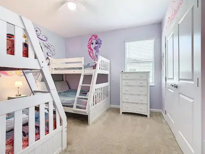 a childs room with bunk beds and a staircase at Elegant Villa 12BD-12BA Vacation Haven BV368 in Kissimmee