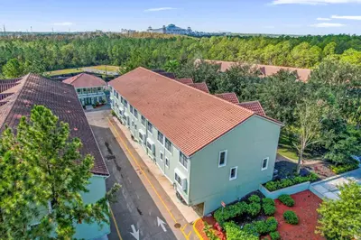 an overhead view of a building with a red roof at Summer Deal - Relax & Unwind, Townhome by Disney! in Orlando