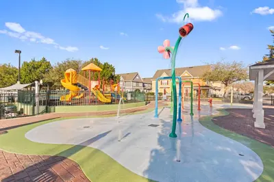 a park with a playground with a slide at The Villas at Seven Dwarfs - 4564 Luxury Villa - Near Disney - Water Park in Kissimmee