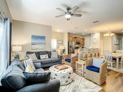 a living room with a couch and a table at Paradise Palms Resort Townhome Close to Disney in Kissimmee