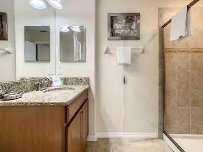 a bathroom with a sink and a shower at Storey Lake Dreamy Townhome, 5 mi Disney Universal in Kissimmee