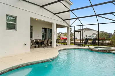 a house with a swimming pool and a patio at Big Family Home with Game Room Sleeps 28 BLV104 in Kissimmee