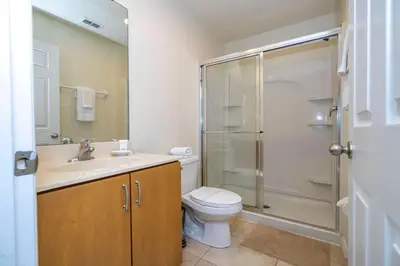a bathroom with a toilet sink and a shower at Perfect Themed 3 BD Hot tub renovated - 3013 in Kissimmee