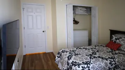 a bedroom with a bed and a white door at UniDisL 3Br3B near Disney quiet resort community, pool, private hot tub, BBQ & games in Kissimmee