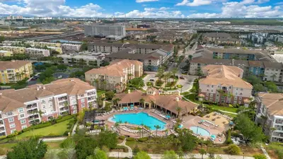 an aerial view of an apartment complex with a swimming pool at The Epic Toronto Vista Cay Orlando in Orlando
