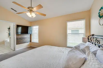 a bedroom with a bed and a ceiling fan at Renovated Kissimmee Home - 10 Mi to Disney Springs in Kissimmee