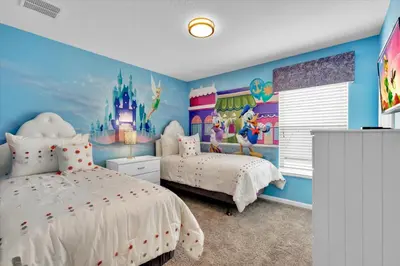 a childs bedroom with a disney bedroom at 8131 Sun Palm in Kissimmee