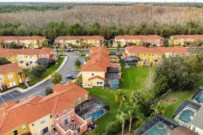 an overhead view of a suburb with houses at 4 Bedroom 3 Bathroom Terra Verde 111PB in Kissimmee