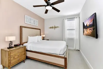 a bedroom with a bed and a ceiling fan at Lavish Home Near Disney With Media, Game & Theme Rooms With Waterpark & Resort Access At Encore Resorts Reunion - 520Bu in Kissimmee