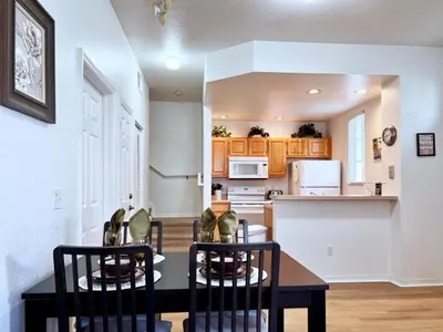 a kitchen and dining room with a table and chairs at Lovely Family Town home in Great Location townhouse in Kissimmee
