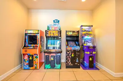 four arcade games are lined up next to each other at 2301 Butterfly Palm Way 101 in Kissimmee