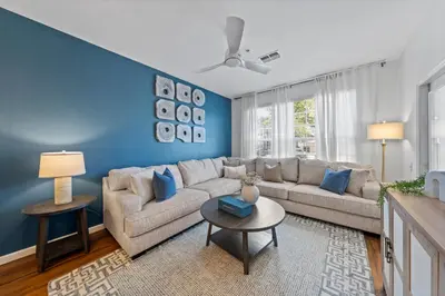 a living room with a couch and a table at 2301 Butterfly Palm Way 101 in Kissimmee