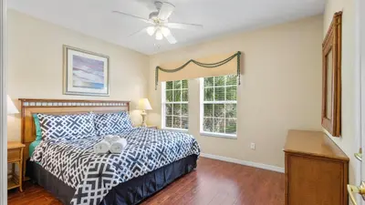 a bedroom with a bed and a window at Shvck5 - Coral Cay Resort #5 - 4 Bed 3 Baths Townhome in Kissimmee