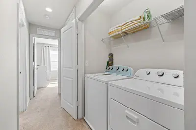 a laundry room with a washer and dryer at Charming Challet at Compass Bay CB101 in Kissimmee