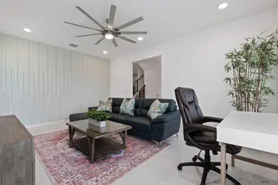 a living room with a couch and a table at Stunning Modern Home VPR102 in Kissimmee