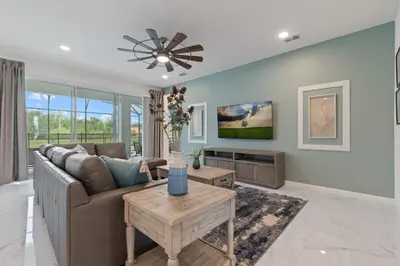 a living room with a couch and a table at Stunning Modern Home VPR102 in Kissimmee