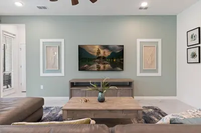 a living room with a couch and a coffee table at Stunning Modern Home VPR102 in Kissimmee