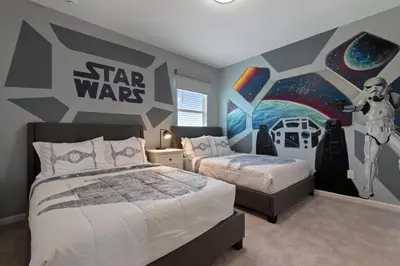 a bedroom with two beds and a star wars mural at Stunning Modern Home VPR102 in Kissimmee