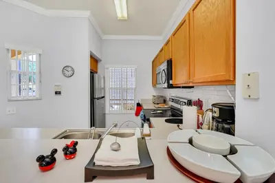 a kitchen with white counters and a counter top at A Peaceful Orlando Escape, nature, comfort & Disney Nearby EMI101 in Kissimmee