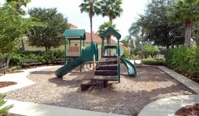 a playground with a slide in a park at A Peaceful Orlando Escape, nature, comfort & Disney Nearby EMI101 in Kissimmee