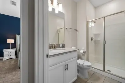 a white bathroom with a sink and a toilet at Comfy Townhome 8 Min to Disney STL120 in Kissimmee