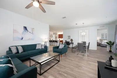 a living room with a couch and a table at Epic Universe Large Condo With Pool Table, Vista Cay - 2003 in Orlando