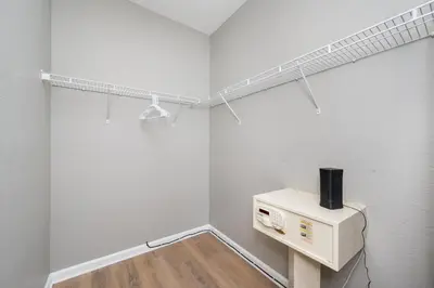 a room with a microwave and a shelf on the wall at Stunning Vacation Condo - Vista Cay Resort - 2008 in Orlando