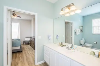 a bathroom with a sink and a large mirror at Beautiful Deluxe Condo, Vista Cay, Orlando - 3008 in Orlando