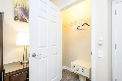a white door leading to a bedroom with a desk at Epic Universe New Beautiful Condo, Vista Cay, Orlando - 3011 in Orlando
