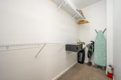 a walk in closet with a skateboard in a room at Epic Universe New Modern Townhome, Near The Parks - 4029 in Orlando