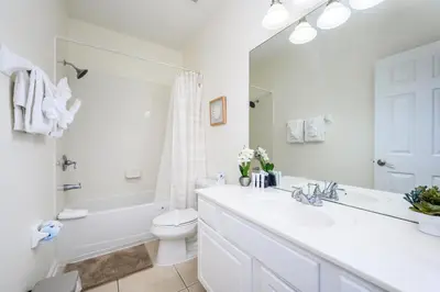 a white bathroom with a sink and a toilet at New Listing, Beautiful Townhome, Vista Cay - 4014 in Orlando