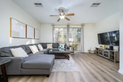 a living room with a couch and a ceiling fan at New Listing, Beautiful Townhome, Vista Cay - 4014 in Orlando