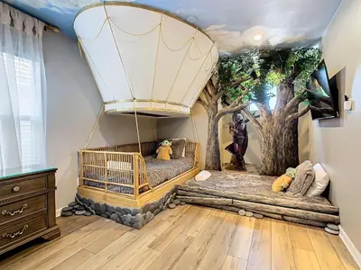 a room with two beds and a balloon at WH7820BS - 5 bedrooms - Pool - Theater - Resort in Orlando