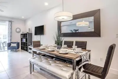 a dining room with a table and chairs at Pond view pool home close to Disney TR17508PA - 3 bedrooms - 3 bath - waterview in Orlando