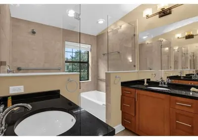 a bathroom with a sink and a shower and a tub at Ultimate Summer Retreat - TownHome by Disney! in Orlando