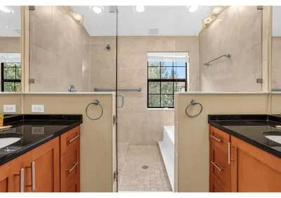 a large bathroom with a shower and a sink at Summer Days Fun - Renovated TownHome by Disney! in Orlando