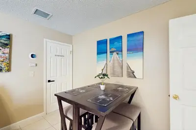 a dining room with a wooden table and chairs at Pool Access! Dog-Friendly Retreat 16 Mi to Orlando in Orlando