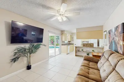 a living room with a couch and a ceiling fan at Pool Access! Dog-Friendly Retreat 16 Mi to Orlando in Orlando
