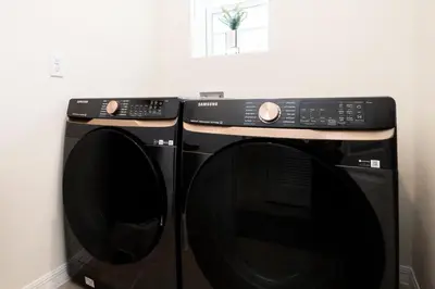 two black microwaves sitting next to each other at Entire House close to Disney in Orlando