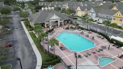 an aerial view of a pool at a resort at The Villas at Seven Dwarfs - 2624 Mickey Villa - Near Disney - Water Park in Kissimmee